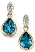 Boucles d oreilles  éclat céleste  en or 9 carats, topaze bleue et diamant