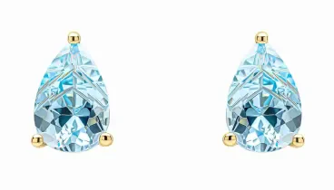 Boucles d'oreilles clous en or jaune 375 carats serties de topazes bleues naturelles.